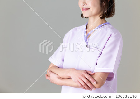 A middle-aged female nurse in a medical scrub A middle-aged female nurse in a medical scrub 136336186