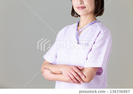 A middle-aged female nurse in a medical scrub A middle-aged female nurse in a medical scrub 136336807