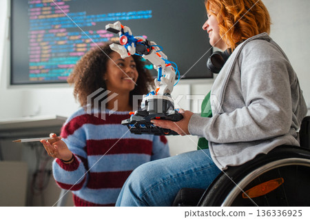 Two students showing classmates their science project. 136336925
