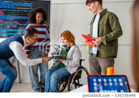 Inclusive student team presenting technology project in class. Inclusive student team presenting technology project in class. 136336946