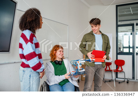 Inclusive student team presenting technology project in class. 136336947