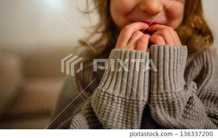 Girl in thick gray sweater. Girl in thick gray sweater. 136337200