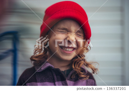 Cute toddler girl smiling with closed eyes. Cute toddler girl smiling with closed eyes. 136337201