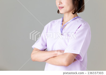 A middle-aged female nurse in a medical scrub A middle-aged female nurse in a medical scrub 136337303