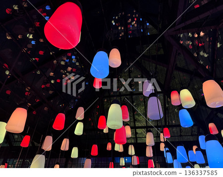 Colorful hanging lights installation in modern interior Colorful hanging lights installation in modern interior 136337585