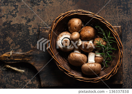 Assorted Fresh Mushrooms In A Basket With Rosemary Sprig 136337838
