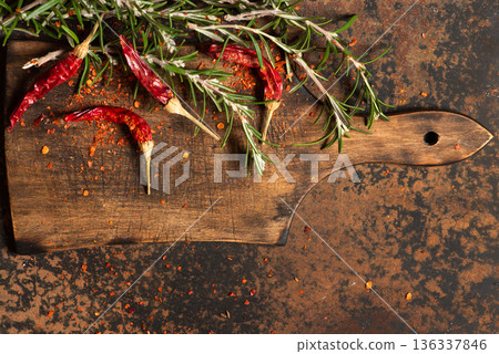 Spices And Aromatic Herbs On A Wooden Cutting Board Spices And Aromatic Herbs On A Wooden Cutting Board 136337846