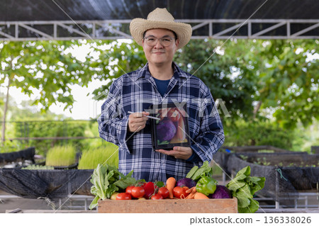 Farmer holding wooden box full of fresh vegetables. Farmer holding wooden box full of fresh vegetables. 136338026