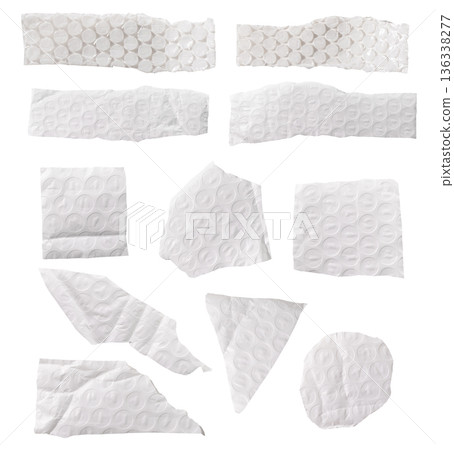 Set of torn bubble wrap pieces with circular air pockets and soft plastic texture. Irregular shapes 136338277