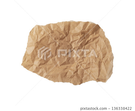 Crumpled brown kraft paper piece with deep wrinkles, rough torn and teared edges, and organic Crumpled brown kraft paper piece with deep wrinkles, rough torn and teared edges, and organic 136338422