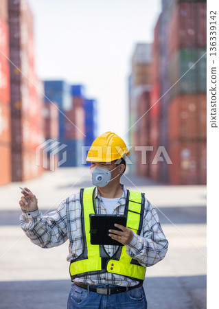 Foreman or worker work at Container cargo site check up goods in container. Foreman or worker work at Container cargo site check up goods in container. 136339142