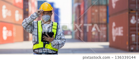 Foreman or worker work at Container cargo site check up goods in container. Foreman or worker work at Container cargo site check up goods in container. 136339144