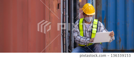 Foreman or worker work at Container cargo site check up goods in container.  136339153