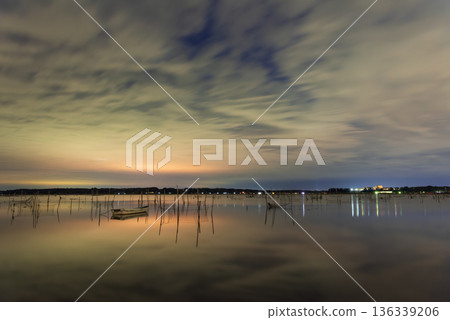 Morning glow reflected on the water surface Morning glow reflected on the water surface 136339206
