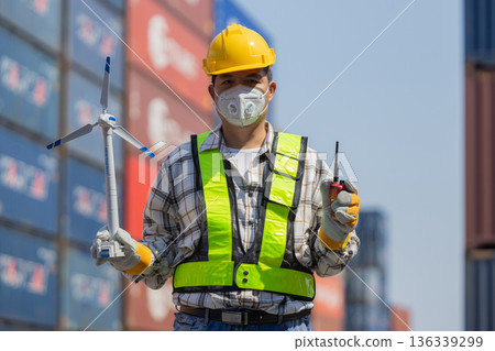 Foreman or worker work at Container cargo site check up goods in container. Foreman or worker work at Container cargo site check up goods in container. 136339299