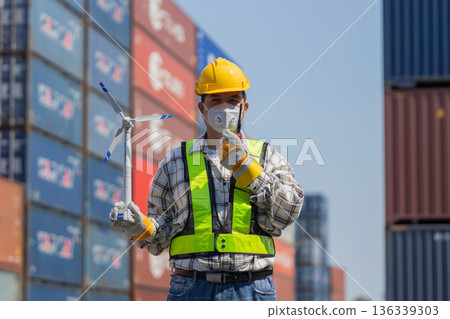 Foreman or worker work at Container cargo site check up goods in container. Foreman or worker work at Container cargo site check up goods in container. 136339303