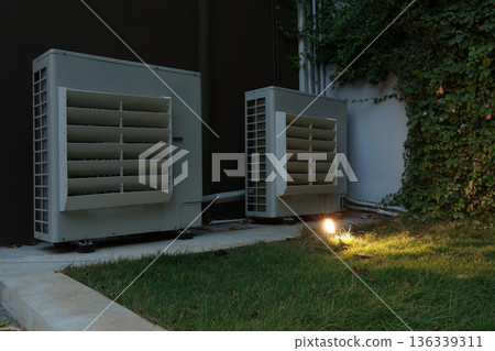 Air conditioner compressor installed in old building. Air conditioner compressor installed in old building. 136339311