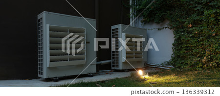 Air conditioner compressor installed in old building.  136339312