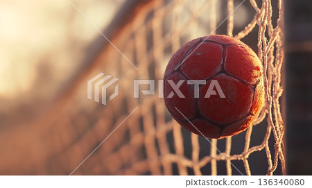 Soccer Ball Hitting The Goal Net During Golden Hour Sunset Soccer Ball Hitting The Goal Net During Golden Hour Sunset 136340080
