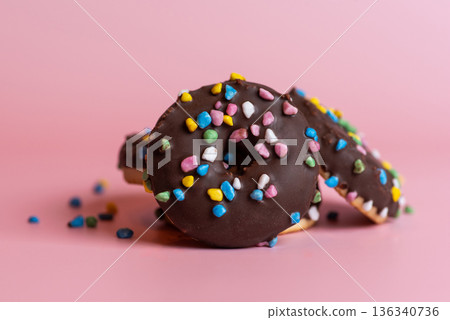 Colorful Donuts With Sprinkles On A Pink Background Delightfully 136340736