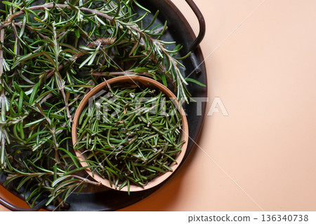 Fresh Rosemary Sprigs And Leaves On Tray For Culinary Use Fresh Rosemary Sprigs And Leaves On Tray For Culinary Use 136340738