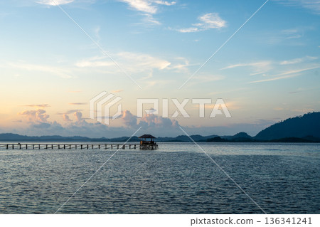 Sunset view of pier on Bolilanga Island, Togian archipelago, Sulawesi, Indonesia Sunset view of pier on Bolilanga Island, Togian archipelago, Sulawesi, Indonesia 136341241