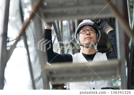 Men in work clothes, knickerbockers, helmet 136341326