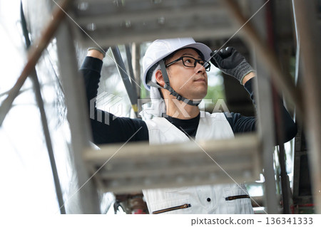 Men in work clothes, knickerbockers, helmet 136341333