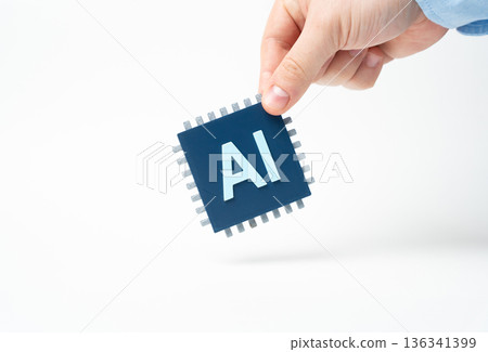 AI chip in hand. Computer Microchip with Artificial Intelligence. Advanced semiconductor symbolizes innovation. High tech hardware powers data, automation and smart devices. AI chip in hand. Computer Microchip with Artificial Intelligence. Advanced semiconductor symbolizes innovation. High tech hardware powers data, automation and smart devices. 136341399