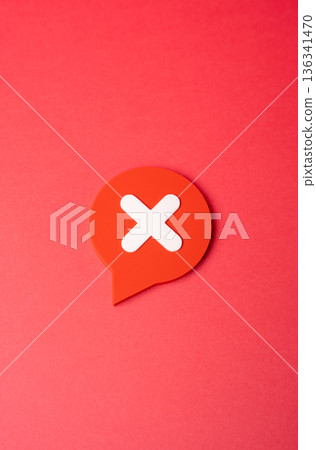 A comment with a disclaimer or prohibition symbol. Disagreement, denial and non-recognition. Visual metaphor for content moderation, user rights, and clear communication of refusal in digital space 136341470