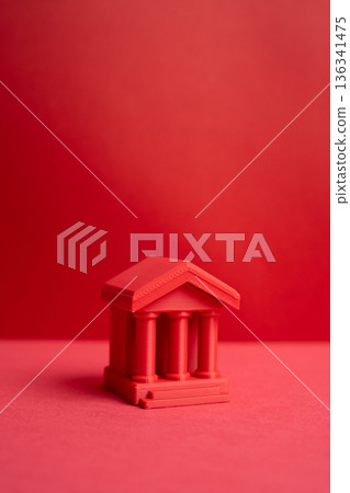 A red bank figure. State control concept, financial authority, regulation power and centralized economic. Finance and public administration. 136341475
