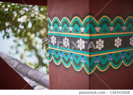Painted decorative border on pillar with floral motif in Asian temple Painted decorative border on pillar with floral motif in Asian temple 136341608