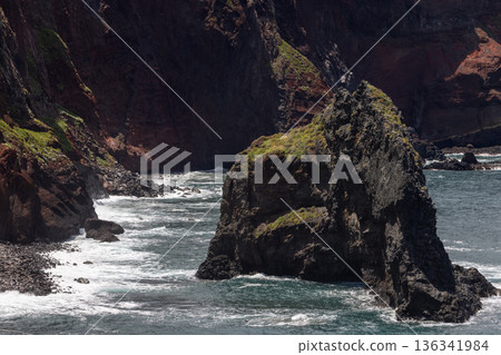 Volcanic sea stack in Atlantic inlet at Point of Saint Lawrence Madeira Volcanic sea stack in Atlantic inlet at Point of Saint Lawrence Madeira 136341984