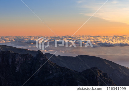 Mountain ridge at Sao Roque do Faial Madeira Portugal, sunrise above cloud fields Mountain ridge at Sao Roque do Faial Madeira Portugal, sunrise above cloud fields 136341999