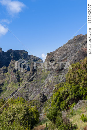 Rocky gorge near Curral das Freiras Madeira, volcanic cliffs and blue sky 136342007