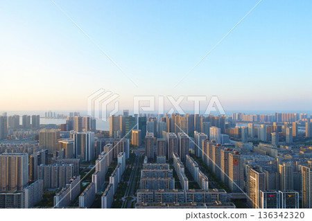 aerial city view with crossroads and roads, houses 136342320