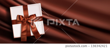 Brown silk background, white gift box, satin ribbon Brown silk background, white gift box, satin ribbon 136342421