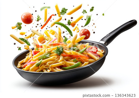 Pasta penne vegetable frying pan cooking tomato pepper carrot green bean parsley healthy pasta dish with colorful vegetable flying above frying 136343623