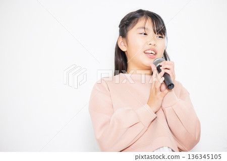 Family doing karaoke 136345105