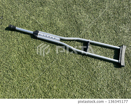 crutch on the playground. conecpt accessible environment 136345177