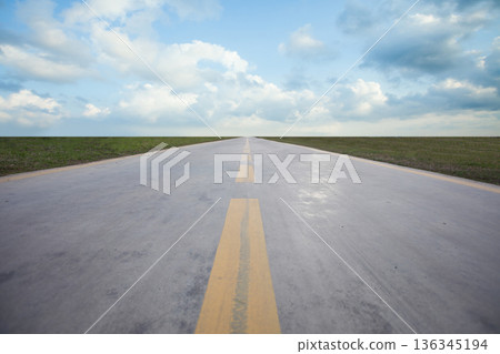 Straight highway road and blue sky with white clouds Straight highway road and blue sky with white clouds 136345194