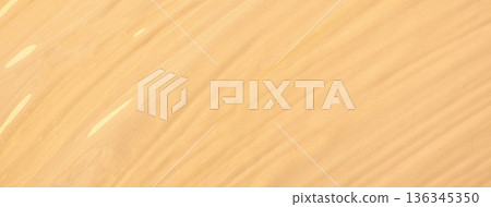 Warm beige fluid acrylic paint texture art background with diagonal brush strokes and creamy flowing abstract lines 136345350