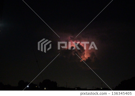 Lightning shining in the darkness, night, thunderclouds Lightning shining in the darkness, night, thunderclouds 136345405