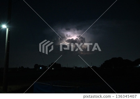 Lightning shining in the darkness, night, thunderclouds 136345407