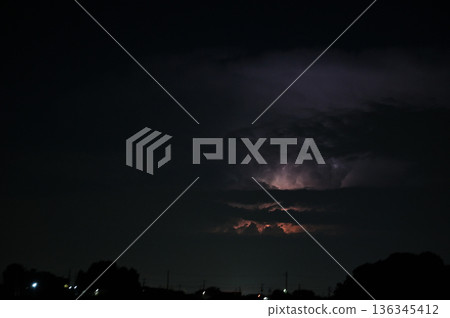 Lightning shining in the darkness, night, thunderclouds Lightning shining in the darkness, night, thunderclouds 136345412