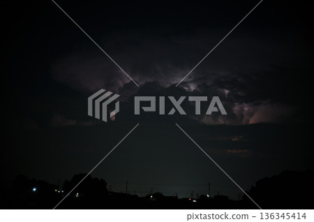 Lightning shining in the darkness, night, thunderclouds Lightning shining in the darkness, night, thunderclouds 136345414