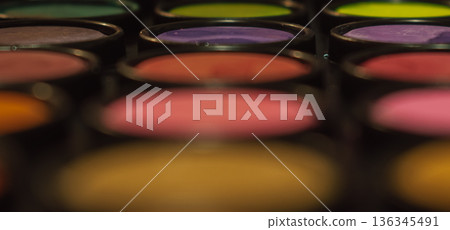 Abstract macro close-up of a colorful makeup or artist paint palette with shallow depth of field. Symbolize creativity, art, and cosmetics Abstract macro close-up of a colorful makeup or artist paint palette with shallow depth of field. Symbolize creativity, art, and cosmetics 136345491