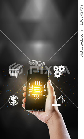 A hand holding a smartphone featuring glowing digital icons for e-commerce, finance, and automation, representing modern mobile business solutions and technology integration A hand holding a smartphone featuring glowing digital icons for e-commerce, finance, and automation, representing modern mobile business solutions and technology integration 136345775