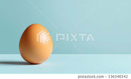 Single brown chicken egg on blue pastel background minimal food still life composition 136346542