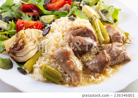 Turkey with fennel on couscous plate 136346801